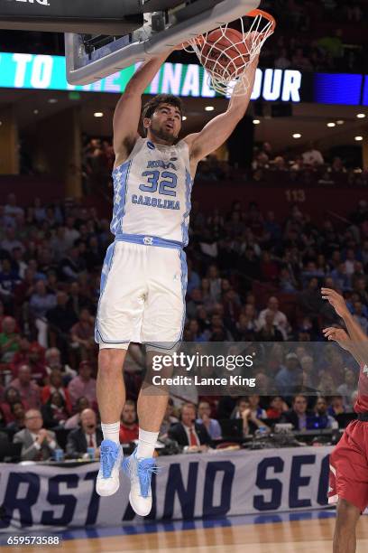 Luke Maye of the North Carolina Tar Heels dunks the ball against the Arkansas Razorbacks during the second round of the 2017 NCAA Men's Basketball...