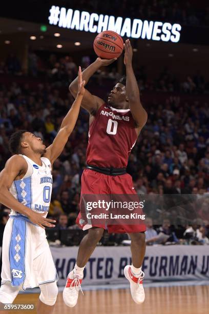 Jaylen Barford of the Arkansas Razorbacks puts up a shot against Nate Britt of the North Carolina Tar Heels during the second round of the 2017 NCAA...