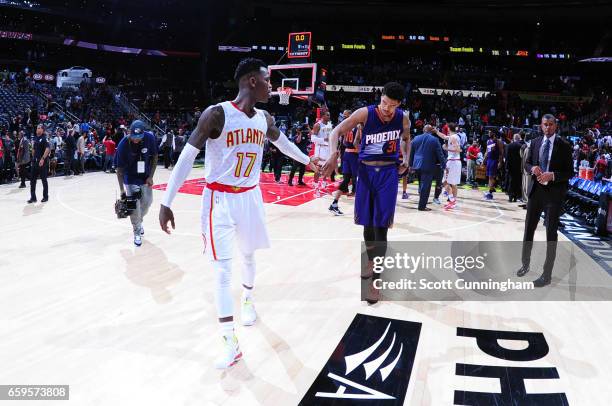 Dennis Schroder of the Atlanta Hawks shakes hands with Jarell Eddie of the Phoenix Suns after a game on March 28, 2017 at Philips Arena in Atlanta,...