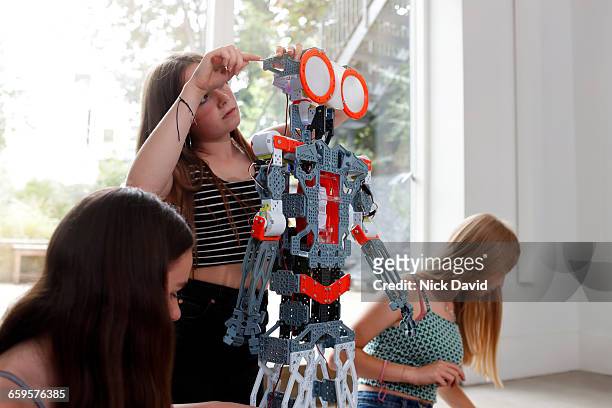 Girls building a robot