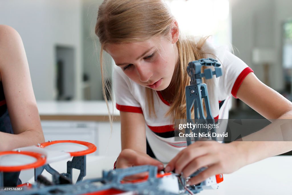 Girls building a robot