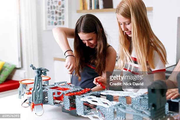 Girls building a robot