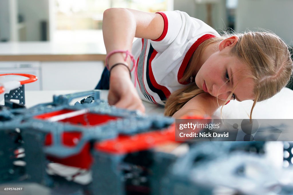 Girls building a robot