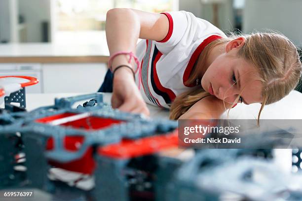 girls building a robot - child with robot stock pictures, royalty-free photos & images