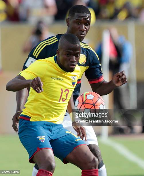 Enner Valencia of Ecuador fights for the ball with Cristian Zapata of Colombia during a match between Ecuador and Colombia as part of FIFA 2018 World...