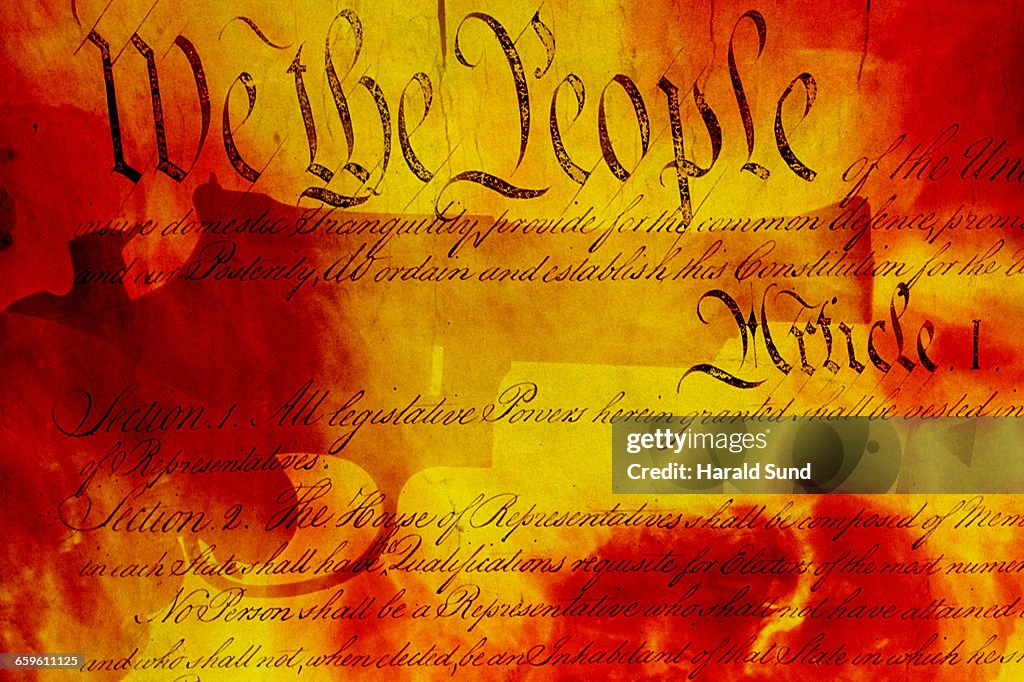 Handgun, USA Constitution, fiery background.