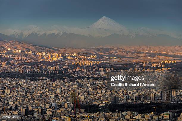 city & mount dam?vand from milad tower - tehran city stock pictures, royalty-free photos & images