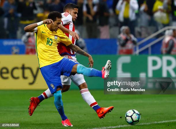 Neymar of Brazil struggles for the ball during a match between Brazil and Paraguay as part of 2018 FIFA World Cup Russia Qualifier at Arena...