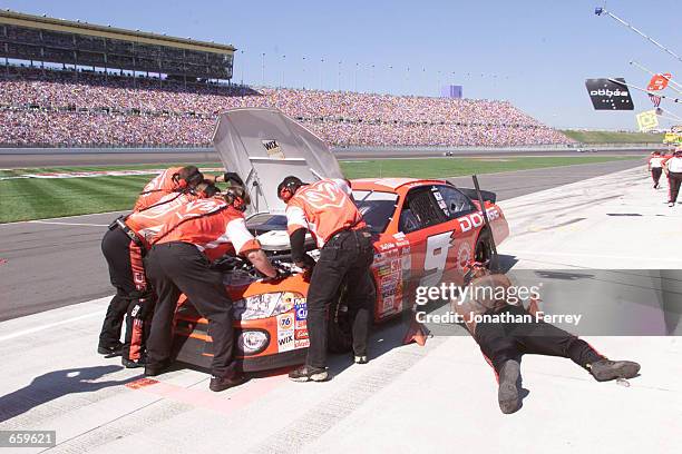 Bill Elliott's crew works on his Evernham Motorsports Dodge Intrepid during the NASCAR Winston Cup Series Protection One 400 at Kansas Speedway in...