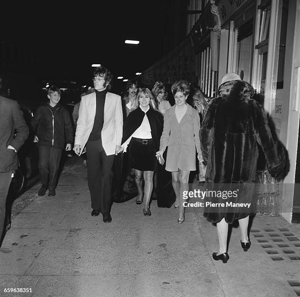 John Lennon and his wife Cynthia arriving at the launch party for the Apple boutique, run by the Beatles' Apple Corps, on Baker Street, London, 5th...