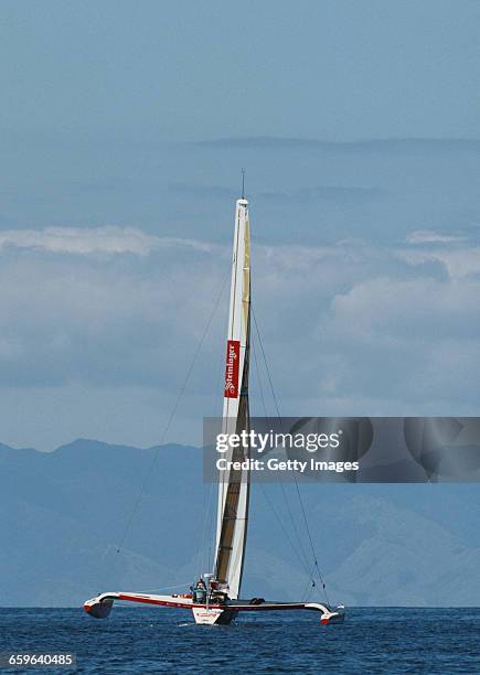 Yachtsmen Peter Blake and Mike Quilter of New Zealand sail the Steinlager 1 trimaran racer across the Pacific Ocean during the Bicentennial...