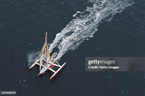Yachtsmen Peter Blake and Mike Quilter of New Zealand sail the Steinlager 1 trimaran racer across the Pacific Ocean during the Bicentennial...