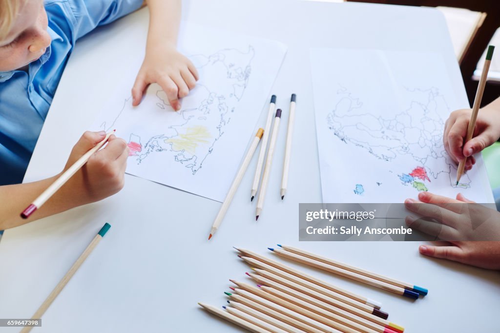 Two school children doing school work