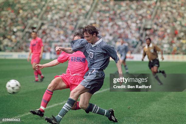 Steve McManaman crosses for England in a Century Challenge Cup match against Hong Kong Golden Select XI, at the Happy Valley Stadium, Hong Kong,...