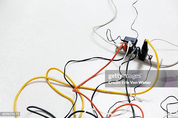 power strip with multiple cables plugged in - electricity white background stock pictures, royalty-free photos & images