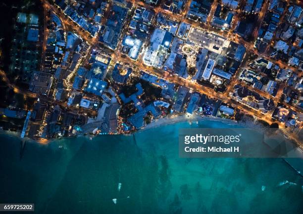 aerial view of waikiki, hawaii at dusk - american port stock pictures, royalty-free photos & images