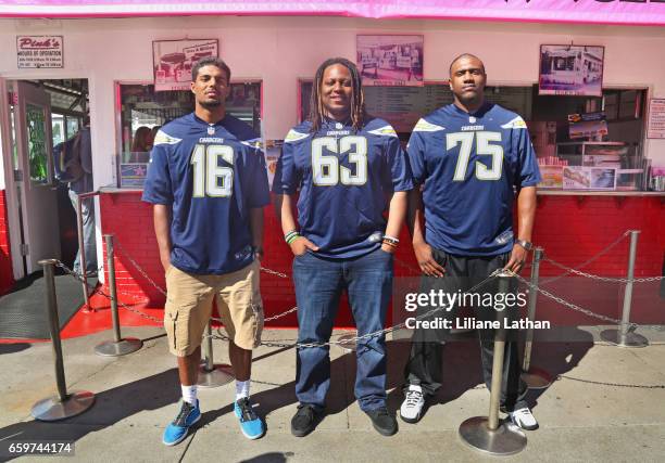 Wide Receiver Tyler Williams, Guard Donavon Clark and Tackle Chris Hairston attend the unveiling of the "Chargers Chilli Cheese" at Pink's Hot Dogs...