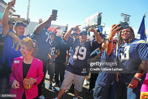 Tackle Chris Hairston and Guard Donavon Clark interact with fans at the unveiling of the "Chargers Chilli Cheese" at Pink's Hot Dogs on March 14,...