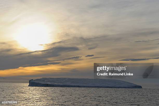 tabular iceberg at sunset - antarctic sound stock pictures, royalty-free photos & images