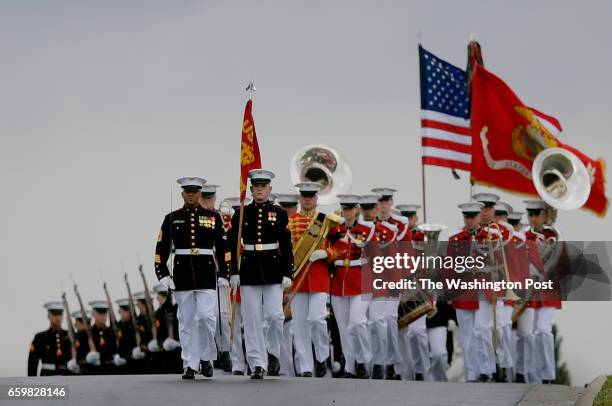 Member of the Marine Corps Band with honor guard preceeds a caisson transfering the remains of Marine Pvt. Harry K. Tye of Orinoco, Kentucky to his...