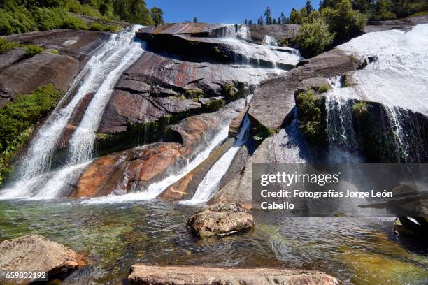 waterfall "la grande" in lagoon alerces area - granito stock pictures, royalty-free photos & images