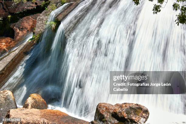 close view of waterfall "la grande" in lagoon alerces area longexposition shot - granito stock pictures, royalty-free photos & images