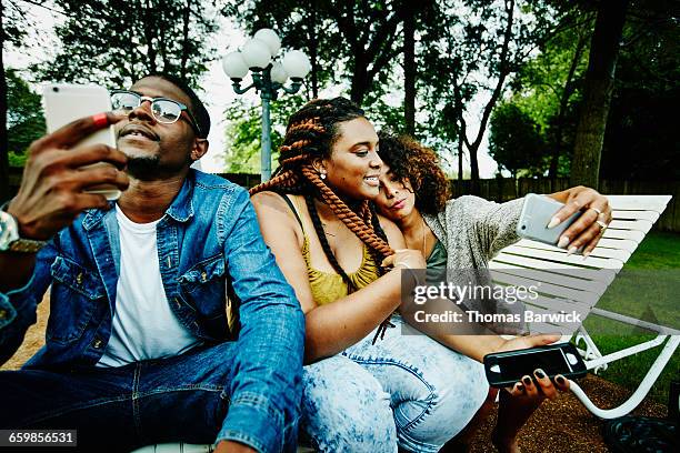 friends taking selfie on smartphone during party - body issue celebration party stock pictures, royalty-free photos & images