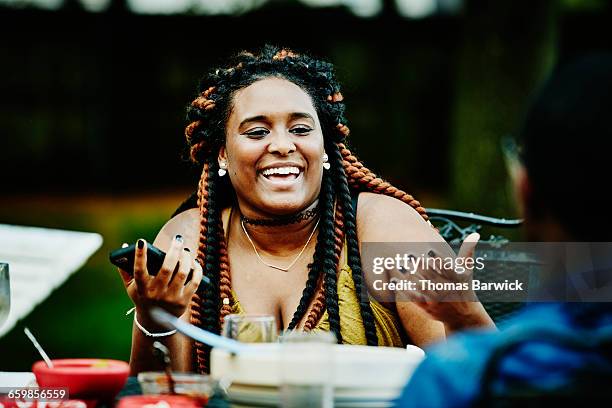 laughing woman in discussion with friends - body issue celebration party stock pictures, royalty-free photos & images