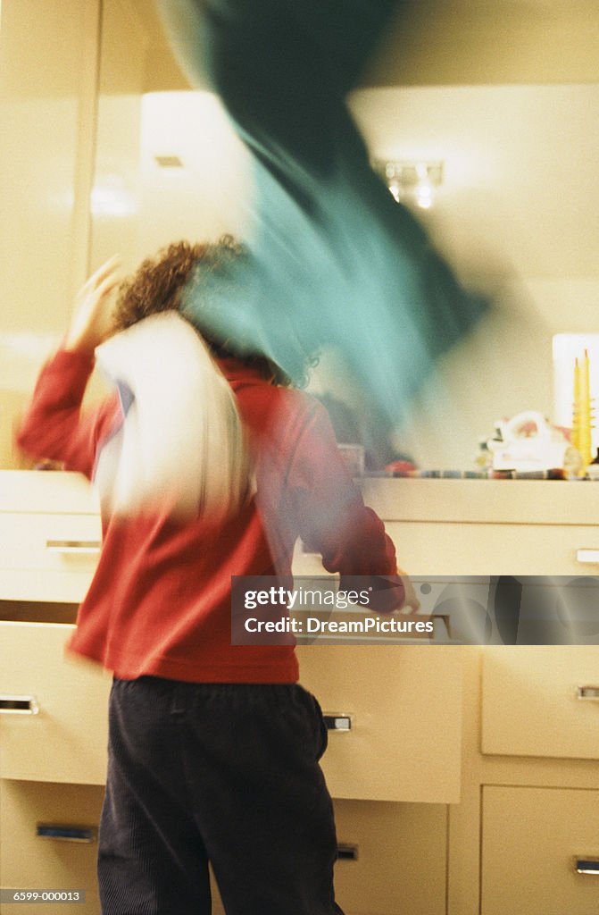 Girl Throwing Clothes