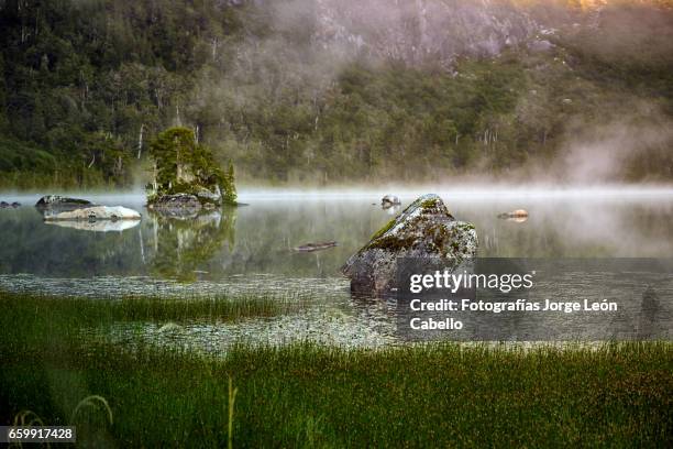 morning fog over lake quetrus - tiempo atmosférico stockfoto's en -beelden