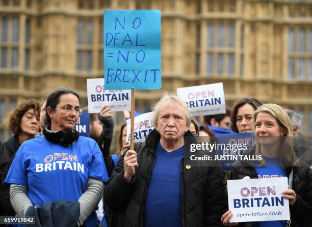 Demontrators from pro-EU group Open Britain protest outside of the Houses of Parliament in central London on March 29, 2017. British Prime Minister...