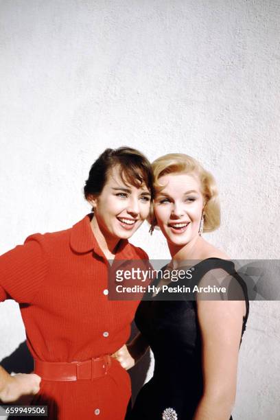 Miss Universe Carol Morris and Miss Sweden Ingrid Goude pose for a portrait on November 7, 1955.