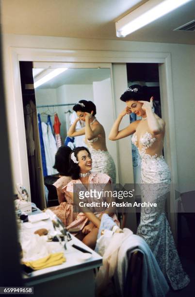Actress and model Kitty Dolan talks to another showgirl dancer in the dressing room at The Tropicana Hotel circa 1958 in Las Vegas, Nevada.