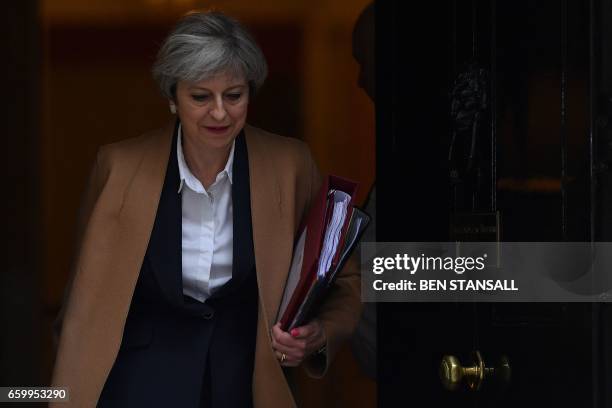 British Prime Minister Theresa May leaves 10 Downing Street before heading to the Houses of Parliament to attend the weekly Prime Minister's...