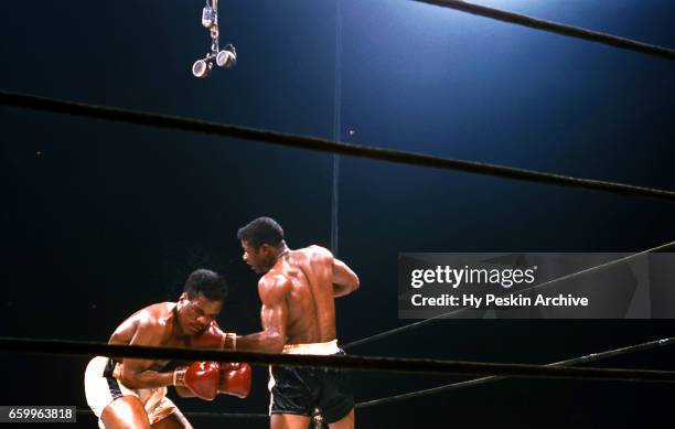 Floyd Patterson punches Thomas "Hurricane" Jackson during their heavyweight fight at Madison Square Garden on June 8, 1956 in New York, New York.