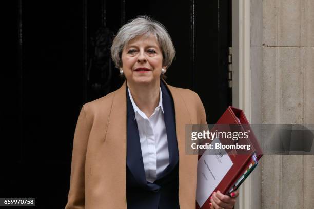 Theresa May, U.K. Prime minister, leaves number 10 Downing Street on her way to speak in the House of Commons in London, U.K., on Wednesday, March...