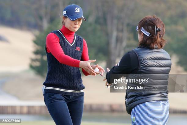 Eri Fukuyama shakes hands after winning playoff against Kurumi Dohi during the final round of the Rashink Nijinia/RKB Ladies at the Queens Hill Golf...