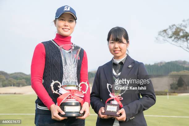 Eri Fukuyama celebrates with a trophy after winning the final round of the Rashink Nijinia/RKB Ladies with Miyu Sato at the Queens Hill Golf Club on...