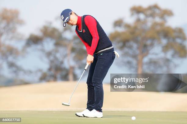 Eri Fukuyama putts on the 18th hole in her playoff with Kurumi Dohi during the final round of the Rashink Nijinia/RKB Ladies at the Queens Hill Golf...