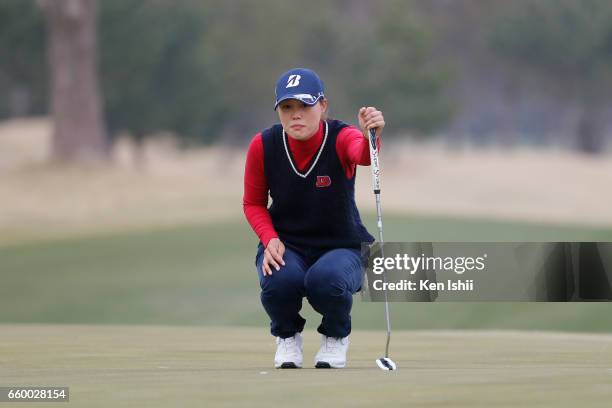 Eri Fukuyama reads her putt on the 15th hole during the final round of the Rashink Nijinia/RKB Ladies at the Queens Hill Golf Club on March 29, 2017...