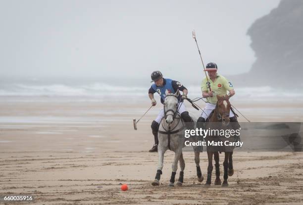 Polo players Andy Burgess riding Tonka and Daniel Loe riding La Sofia practice for the forthcoming Aspall Polo on the Beach at Watergate Bay on March...