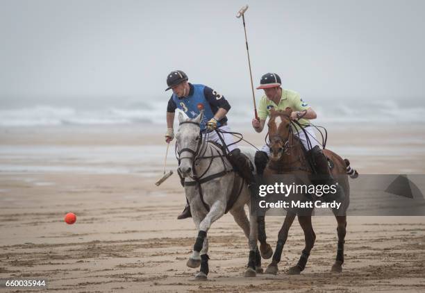 Polo players Andy Burgess riding Tonka and Daniel Loe riding La Sofia practice for the forthcoming Aspall Polo on the Beach at Watergate Bay on March...