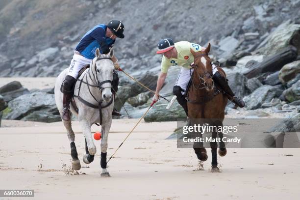 Polo players Andy Burgess riding Tonka and Daniel Loe riding La Sofia practice for the forthcoming Aspall Polo on the Beach at Watergate Bay on March...