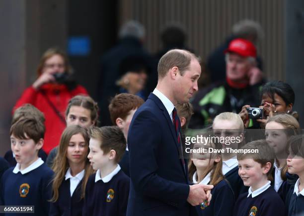 Prince William, Duke of Cambridge meets pupils from All Saints School in Alrewas during the official opening of a new Remembrance Centre at The...