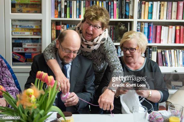 Martin Schulz, chairman of the Social Democratic Party of Germany , speaks to elderly residents during a visit to the multi-generational house...