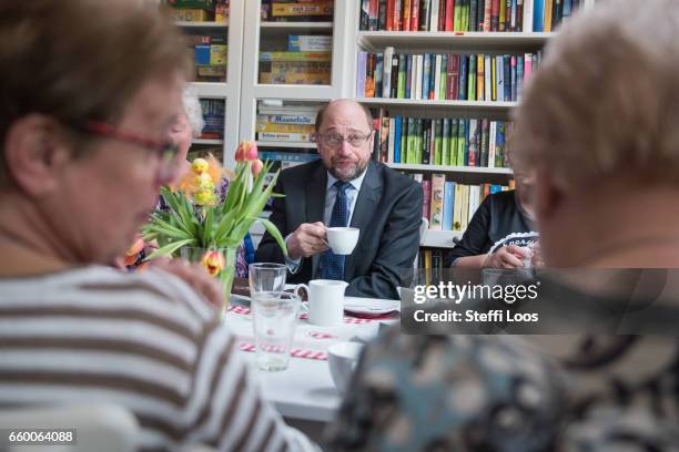 Martin Schulz, chairman of the Social Democratic Party of Germany , speaks to elderly residents during a visit to the multi-generational house...