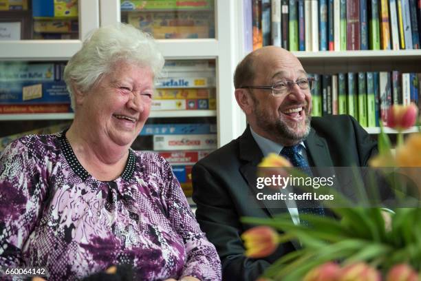 Martin Schulz, chairman of the Social Democratic Party of Germany , speaks to elderly residents during a visit to the multi-generational house...