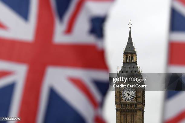 The time 12:20pm shows on Big Ben on March 29, 2017 in London, England. The British Prime Minister Theresa May addresses the Houses of Parliament as...