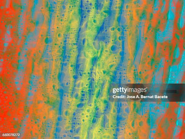 full frame of the textures formed by the bubbles and drops, on a coarse of colors background - arrugado stock pictures, royalty-free photos & images