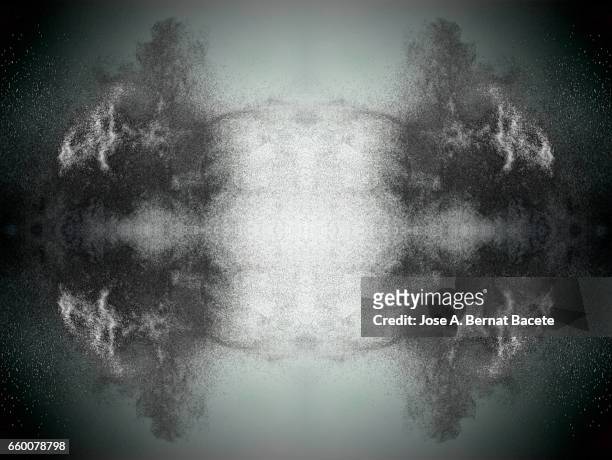 explosion of water drops of  colors gray and white, floating in the air  on a gray background - etéreo stock pictures, royalty-free photos & images